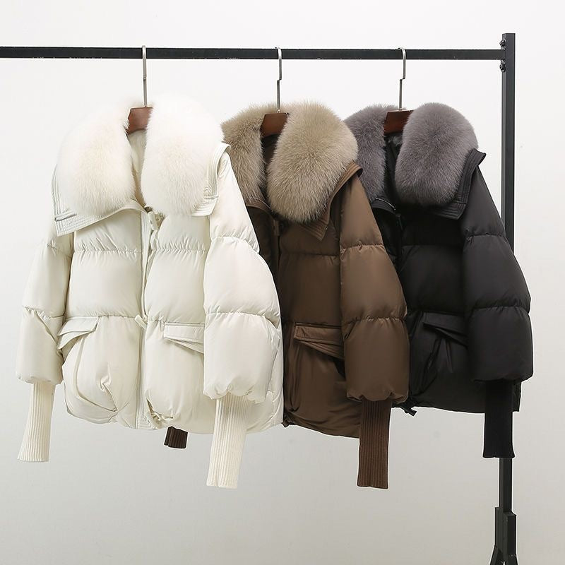 Women's black longline puffer jacket with faux fur collar