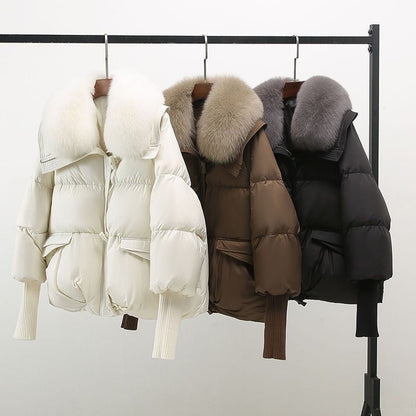 Women's black longline puffer jacket with faux fur collar