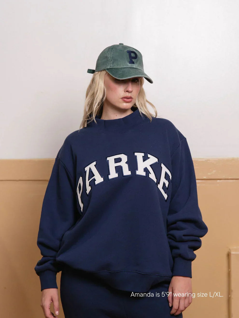 Navy mock neck varsity sweatshirt with white chenille lettering