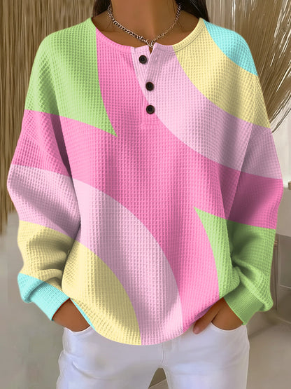 Women's pink henley sweater with geometric pattern