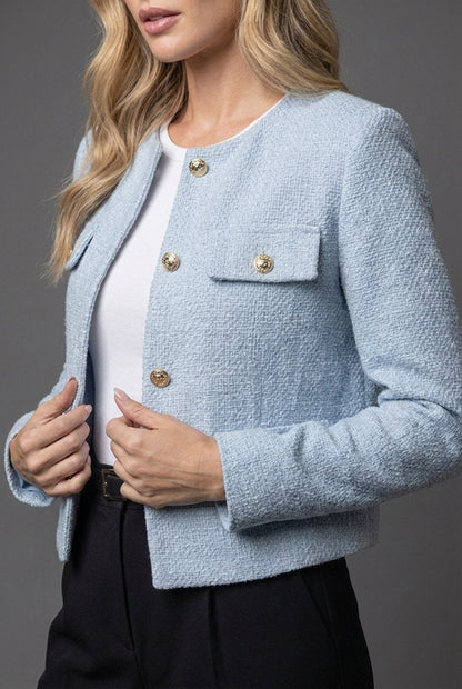 Women's light blue cropped tweed jacket with gold buttons