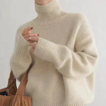 Women's beige cashmere turtleneck sweater with ribbed cuffs