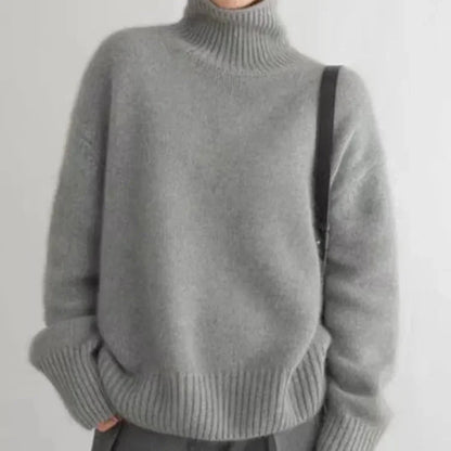 Women's gray cashmere turtleneck sweater with ribbed cuffs