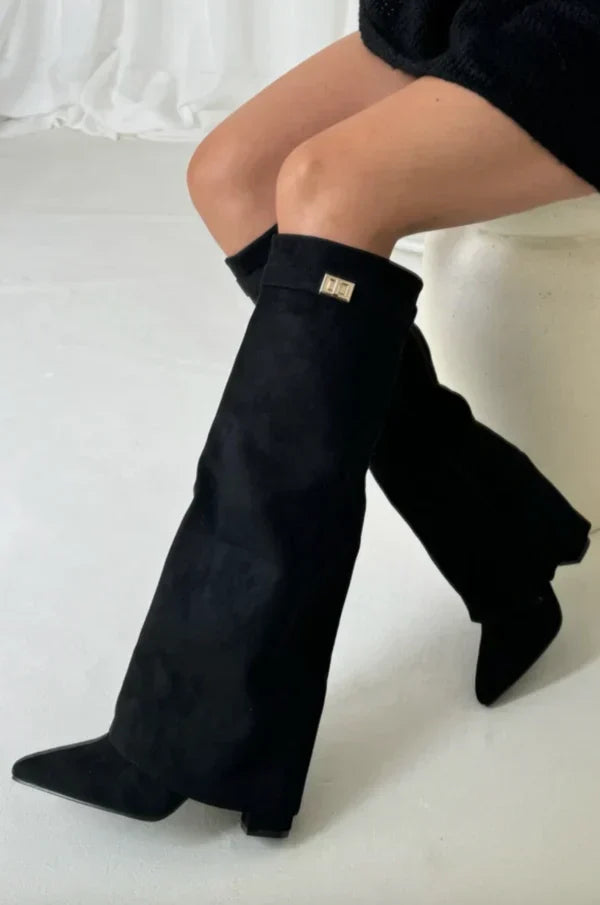 Women's black knee-high boots with gold buckle detail