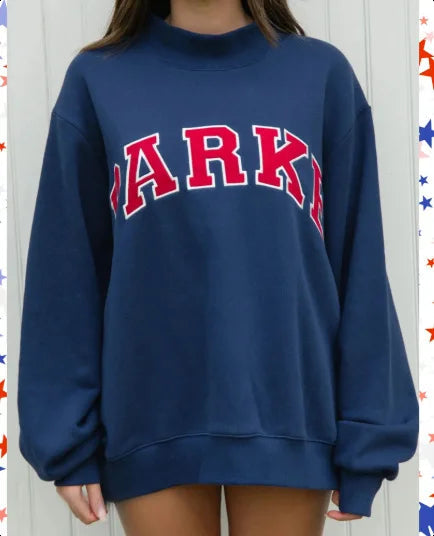 Women's pink mock neck sweatshirt with varsity lettering