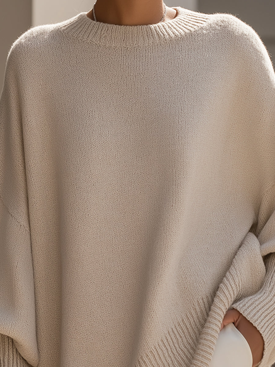 Women's beige oversized poncho sweater with batwing sleeves
