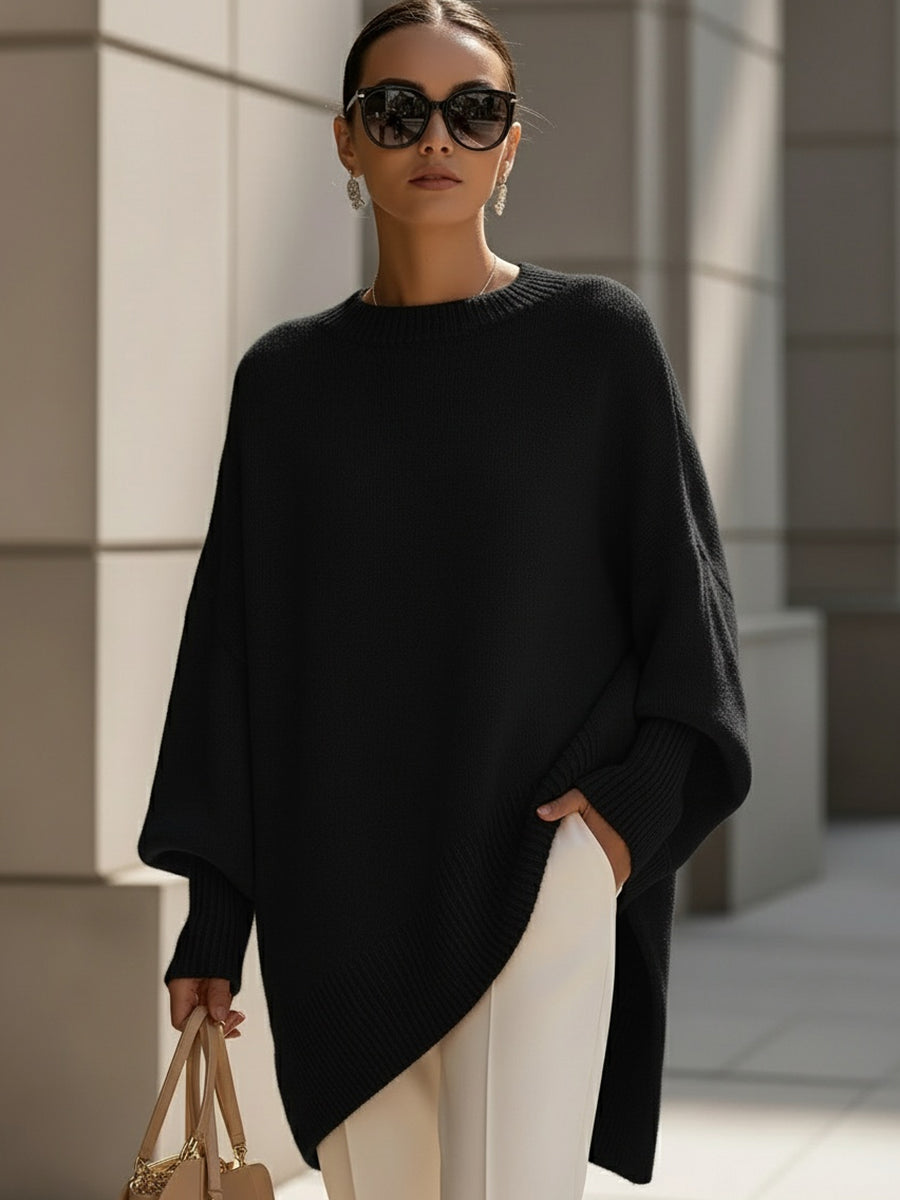 Women's pink oversized poncho sweater with batwing sleeves