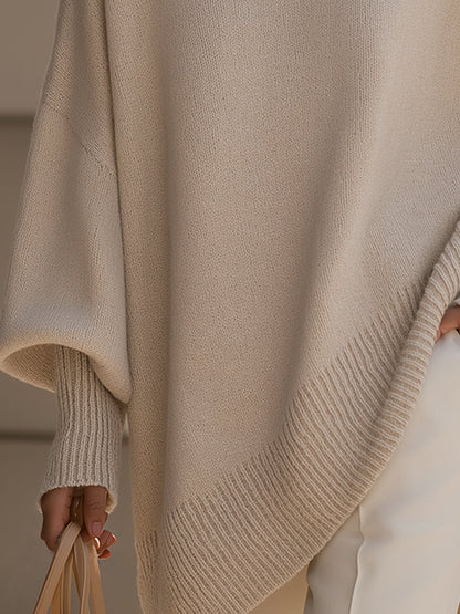 Women's beige oversized poncho sweater with batwing sleeves