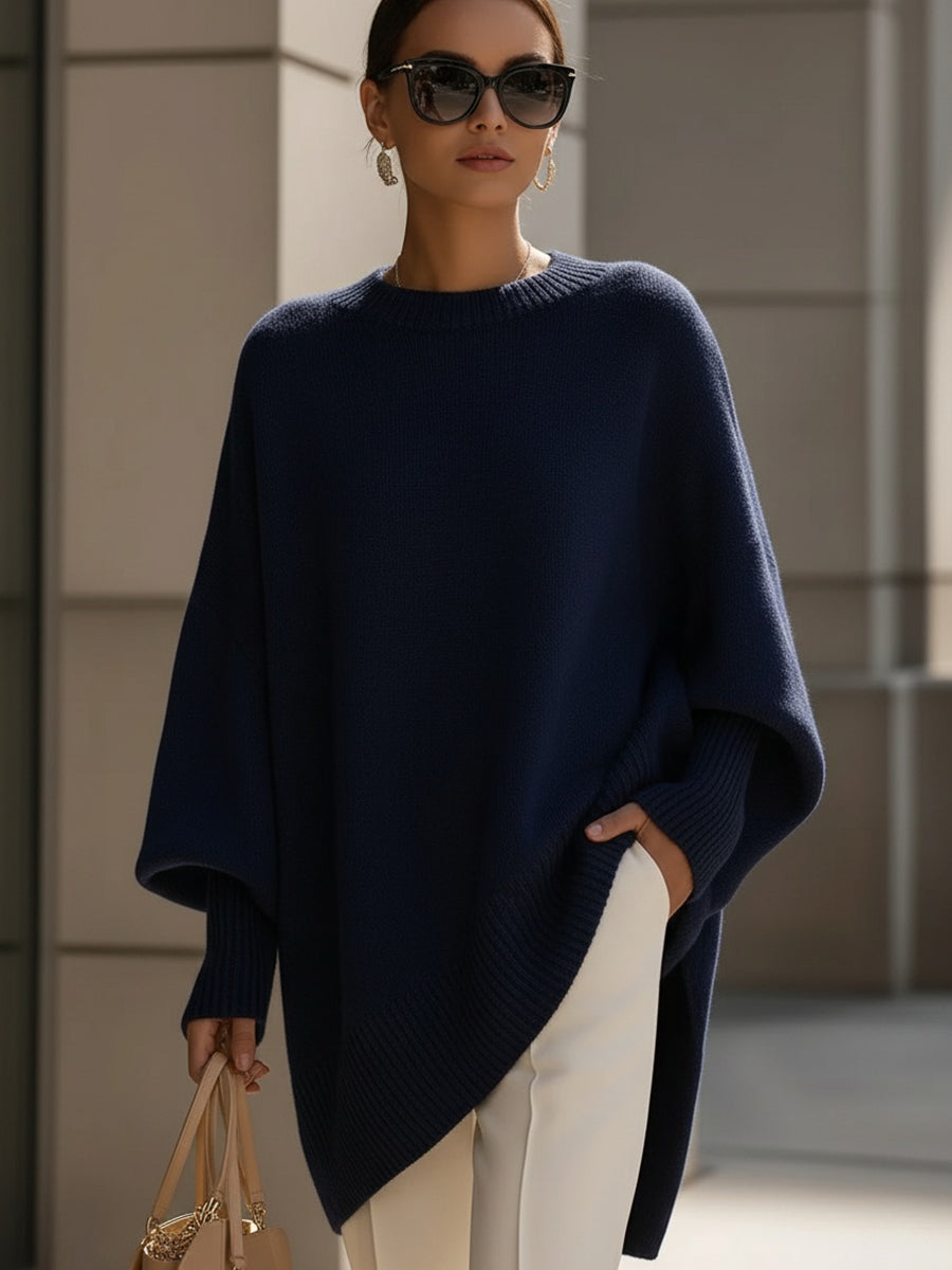 Women's pink oversized poncho sweater with batwing sleeves