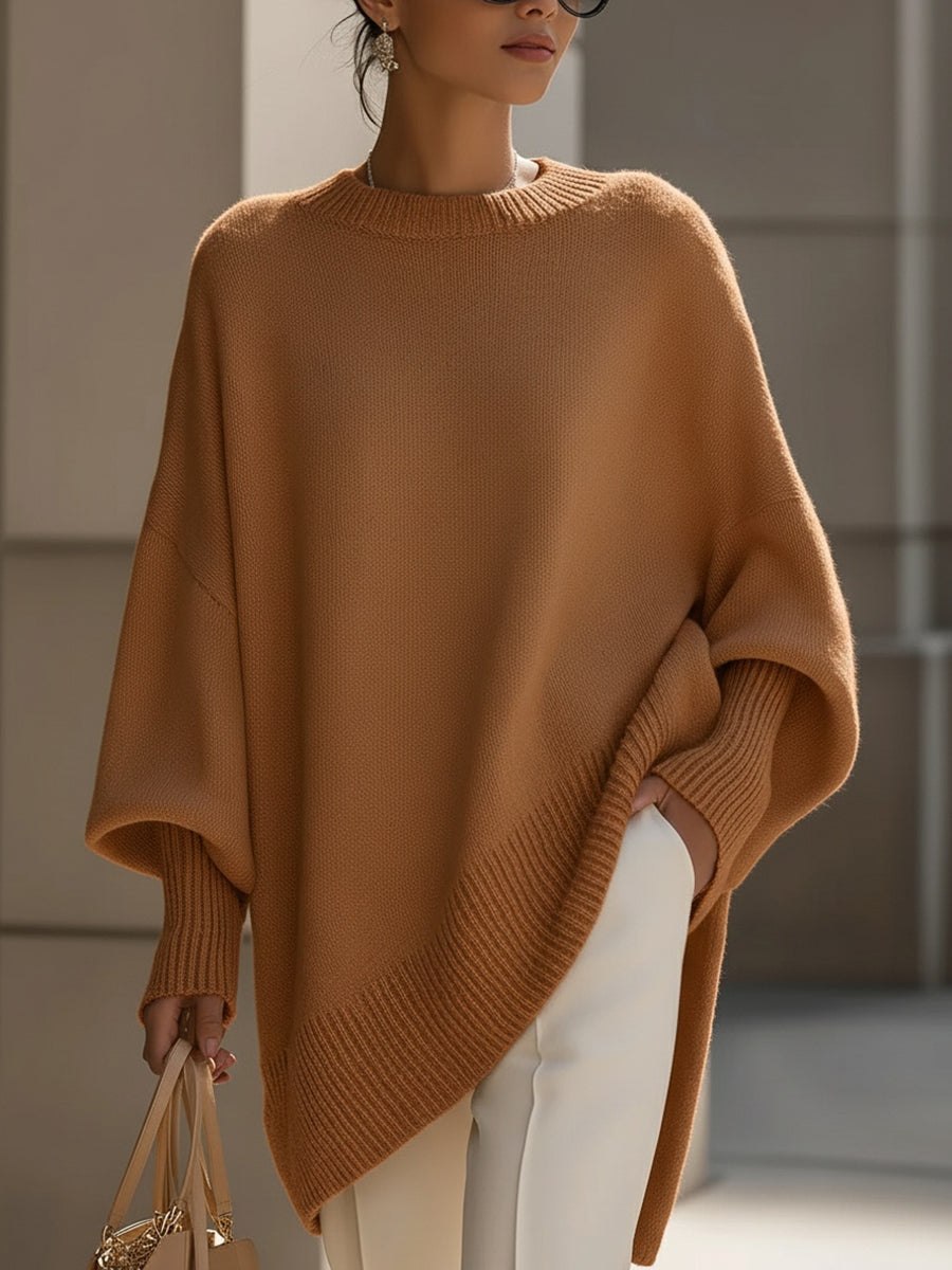 Women's pink oversized poncho sweater with batwing sleeves