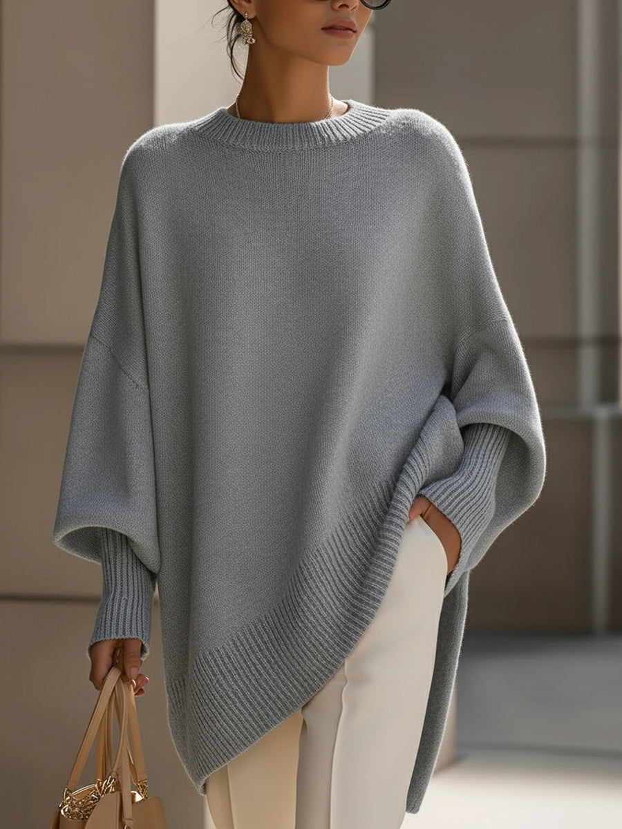 Women's pink oversized poncho sweater with batwing sleeves