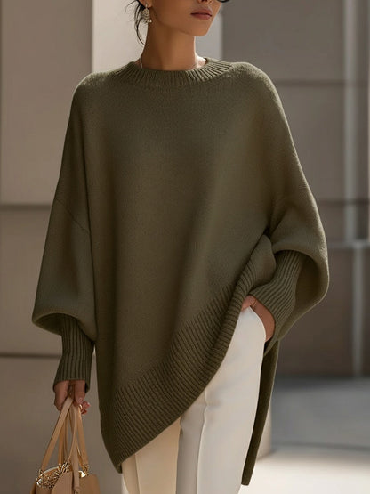 Women's pink oversized poncho sweater with batwing sleeves