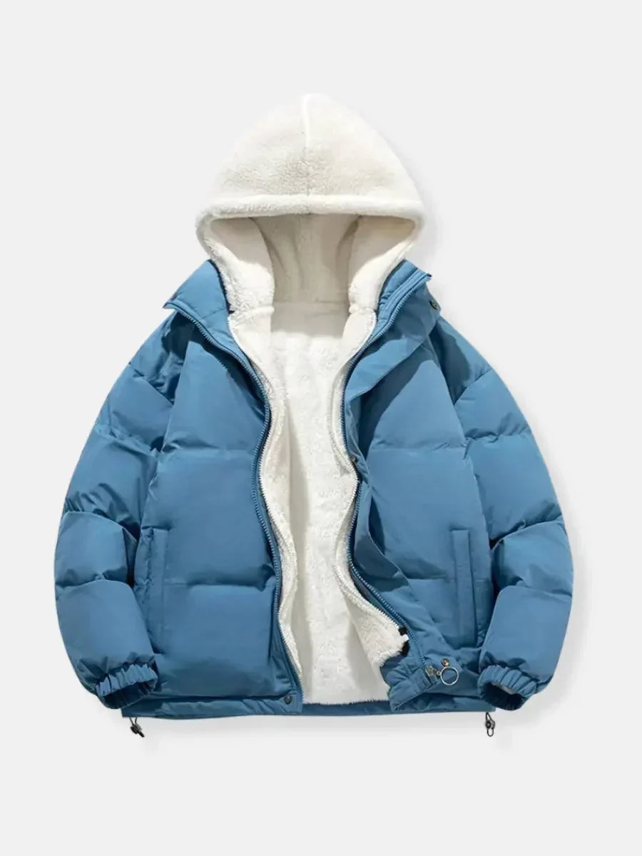 Women's steel blue puffer jacket with sherpa-lined hood